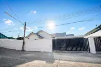 3 Bedroom House for Sale at Paradise Hill 2 street-facing white perimeter wall with black sliding security gate