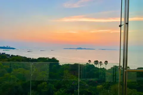 1 Bedroom Condo for Sale in The Cove Pattaya master bedroom with king-size bed