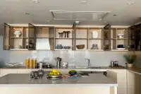 3 Bedroom Condo for Sale at Arom Wongamat kitchen with glass cabinetry and stone countertop island