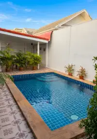 3 Bedroom House for Sale at Siam Executive Estate private tiled swimming pool with covered patio seating area