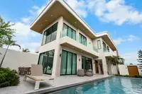 4 Bedroom House for Sale in Perla Villa modern exterior with garden