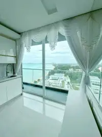2 Bedroom Condo for Sale at Del Mare kitchenette balcony with sliding glass doors overlooking the coastline