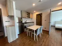 2 Bedroom Condo for Rent at Dormy Residences Sriracha open kitchen with stainless fridge and dining area
