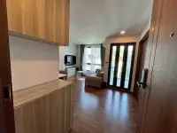 2 Bedroom Condo for Rent at Dormy Residences Sriracha entryway view with wood cabinetry and living room beyond