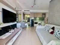 1 Bedroom Condo for Sale at Dusit Grand Condo View open-plan living area with kitchenette and dining table