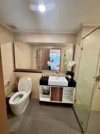 2 Bedroom Condo for Rent at Dusit Grand Park 1 bathroom with vanity sink, mirror, and glass shower stall