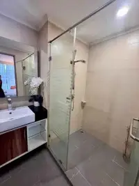 2 Bedroom Condo for Rent at Dusit Grand Park 1 glass-enclosed shower area with tiled walls and floor