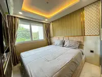 1 Bedroom Condo for Rent at Dusit Grand Park 2 bedroom with gold accent wall and patterned headboard