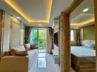 1 Bedroom Condo for Rent at Dusit Grand Park 2 open living area with sofa and view into bedroom