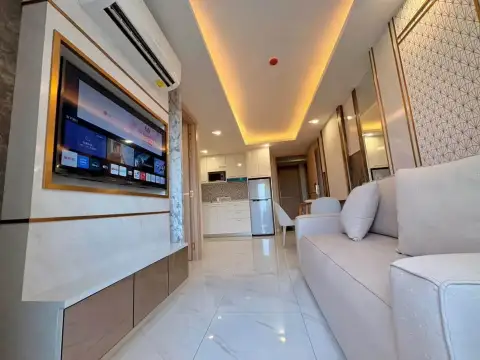 1 Bedroom Condo for Sale at Dusit Grand Park 2 hallway view of living room, kitchen and fridge with marble tile flooring