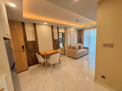 1 Bedroom Condo for Sale at Dusit Grand Park 2 dining table with two chairs beside living room and entrance door