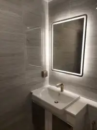 1 Bedroom Condo for Sale at Dusit Grand Park 2 bathroom with backlit mirror, gold faucet and white vanity sink