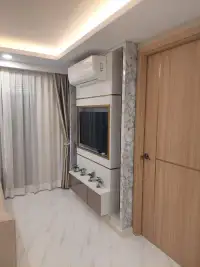 1 Bedroom Condo for Sale at Dusit Grand Park 2 marble TV feature wall with wooden sliding door entrance