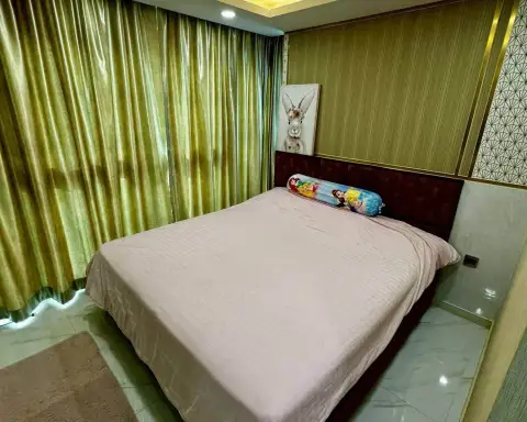 3 Bedroom Condo for Rent at Dusit Grand Park 2 bedroom with king bed and shimmering green curtains