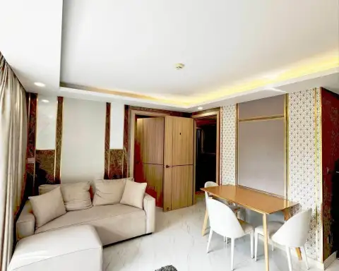 3 Bedroom Condo for Rent at Dusit Grand Park 2 lounge with patterned accent wall and wooden wardrobe