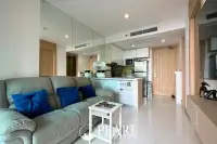 1 Bedroom Condo for Sale in The Riviera Wongamat living room with sofa and TV