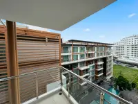 2 Bedroom Condo for Sale at The Urban Pattaya balcony view with wood slat privacy screen and city buildings