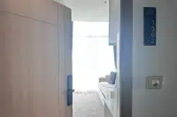 2 Bedroom Condo for Sale at The Twin Tower Jomtien Beach Pattaya unit entry door with number plate 1362 and bright living area beyond
