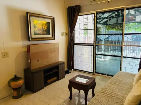 2 Bedroom House for Rent at Eakmongkol 4 living area with TV box, framed artwork and patio window