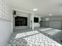 2 Bedroom Townhouse for Rent at Eakmongkol 4 covered driveway and side entrance with tiled flooring