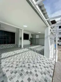 2 Bedroom Townhouse for Rent at Eakmongkol 4 covered parking area with patterned tile flooring and entrance