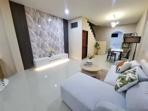 2 Bedroom Townhouse for Sale in East Pattaya living room featuring sofa, dining nook and staircase