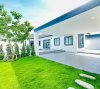 3 Bedroom House for Sale in East Pattaya covered patio overlooking green lawn and garden