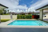 3 Bedroom House for Sale in East Pattaya front pool area with garden shower and neighboring houses