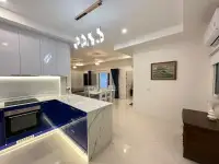 3 Bedroom House for Rent in East Pattaya modern kitchen with blue cabinets and marble countertop