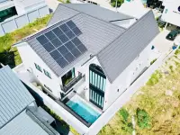 3 Bedroom House for Sale & Rent in East Pattaya rooftop view showing solar panels, tiled roof, and private pool below