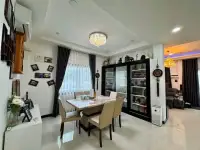 3 Bedroom House for Sale in East Pattaya dining area with marble table, display cabinet, and chandelier