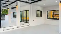 3 Bedroom House for Sale in East Pattaya covered patio with white columns and large glass doors