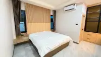 3 Bedroom House for Sale in East Pattaya bedroom with wood slat headboard and air conditioning unit
