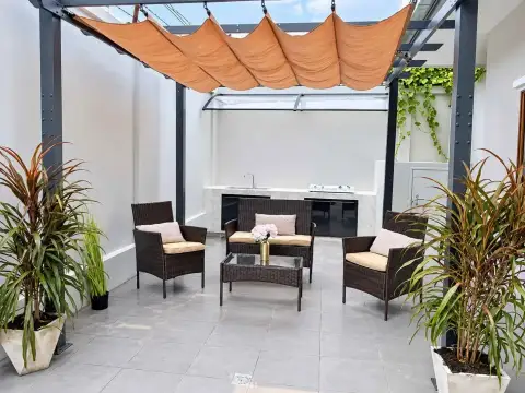 3 Bedroom House for Rent in East Pattaya covered outdoor lounge area with pergola and built-in BBQ counter