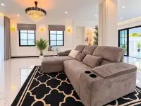 3 Bedroom House for Sale in East Pattaya spacious living room with crystal chandelier and sectional sofa