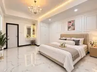 3 Bedroom House for Sale in East Pattaya elegant bedroom with king bed, chandelier, and marble flooring