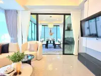 3 Bedroom House for Sale in East Pattaya living room with sofa, TV, and view into dining space