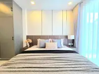 3 Bedroom House for Sale in East Pattaya master bedroom with upholstered headboard and soft lighting