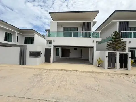 4 Bedroom House for Sale in East Pattaya modern two-story exterior with covered carport and glass balcony