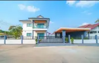 5 Bedroom House for Rent in East Pattaya exterior view with gated entrance and carport