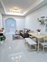 2 Bedroom Townhouse for Sale in East Pattaya open-plan living and dining area with gray sofa