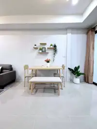 2 Bedroom Townhouse for Sale in East Pattaya dining area with wooden table and floating shelves