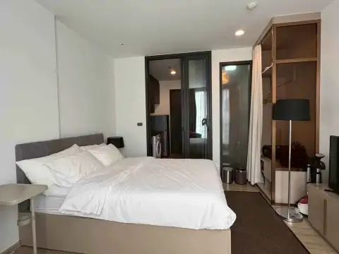 1 Bedroom Condo for Rent at EDGE Central Pattaya bedroom with king bed and open wardrobe closet