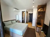 1 Bedroom Condo for Sale at EDGE Central Pattaya bedroom with built-in wardrobe and hallway entrance