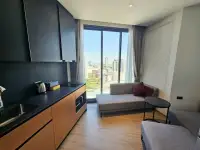 1 Bedroom Condo for Sale at EDGE Central Pattaya kitchenette with black countertops and city skyline view