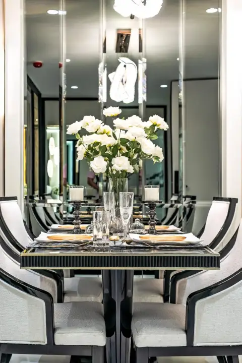 1 Bedroom Condo for Sale at Embassy Life elegant dining table set with white roses and crystal glassware
