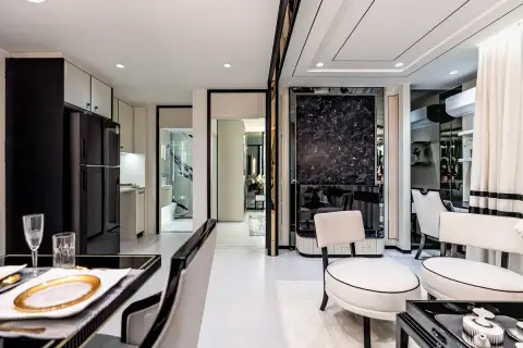 1 Bedroom Condo for Sale at Embassy Life hallway view with marble feature wall and lounge chairs