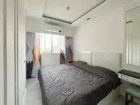 1 Bedroom Condo for Sale at The Empire Tower Pattaya bedroom with patterned curtains and city view window