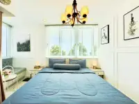 1 Bedroom Condo for Sale at The Empire Tower Pattaya blue bed with chandelier and framed wall art near window