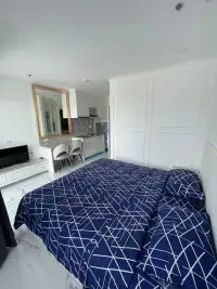 Studio Condo for Sale at The Empire Tower Pattaya open-plan layout with bed, kitchenette and dining nook